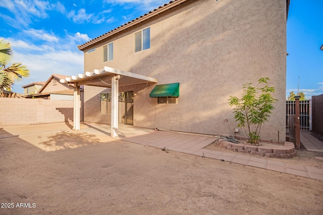2652 E Riviera Dr, Chandler, AZ 85249 - rear view of house with a patio area, stucco siding, a fenced backyard, and a tiled roof