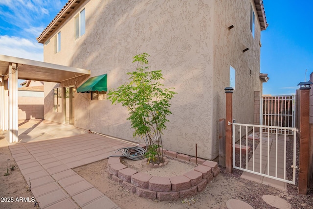 2652 E Riviera Dr, Chandler, AZ 85249 - view of side of property featuring stucco siding and a patio