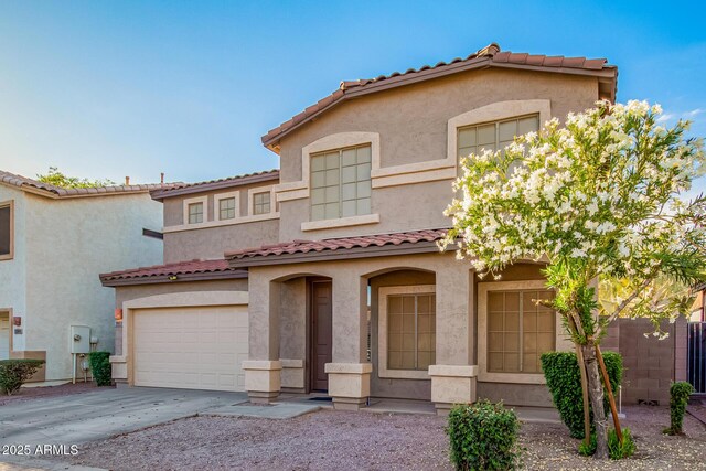 2652 E Riviera Dr, Chandler, AZ 85249 - mediterranean / spanish house with a tiled roof, driveway, stucco siding, and a garage