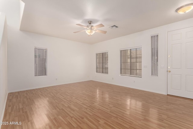 2652 E Riviera Dr, Chandler, AZ 85249 - empty room with a ceiling fan, light wood-type flooring, and baseboards