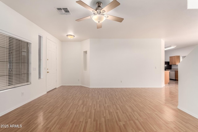 2652 E Riviera Dr, Chandler, AZ 85249 - spare room featuring light wood-style flooring, a ceiling fan, and baseboards