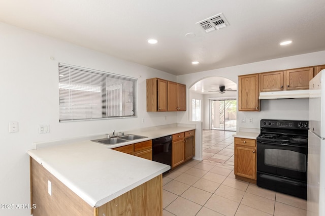 5439 W Sands Rd, Glendale, AZ 85301 - kitchen featuring black appliances, under cabinet range hood, light tile patterned flooring, light countertops, and recessed lighting