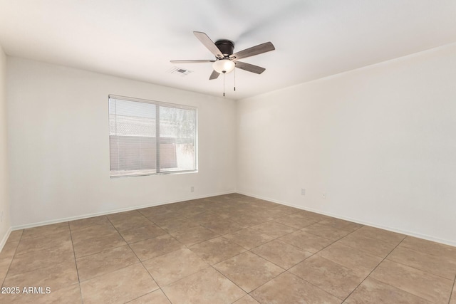 5439 W Sands Rd, Glendale, AZ 85301 - empty room with ceiling fan, light tile patterned floors, and baseboards
