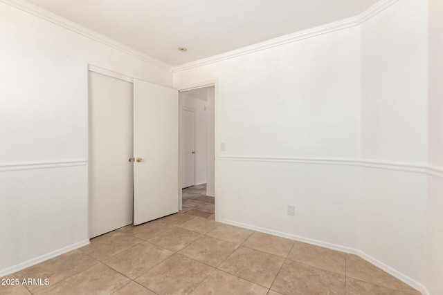5439 W Sands Rd, Glendale, AZ 85301 - spare room featuring ornamental molding, light tile patterned floors, and baseboards