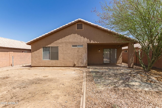 5439 W Sands Rd, Glendale, AZ 85301 - rear view of house featuring a patio, a fenced backyard, stucco siding, and a tiled roof