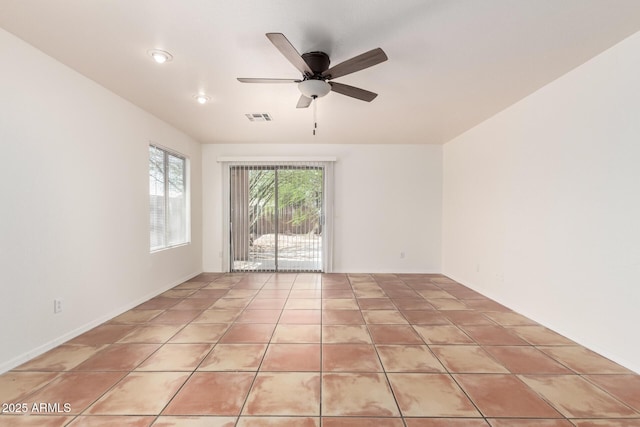 5439 W Sands Rd, Glendale, AZ 85301 - spare room featuring a ceiling fan and light tile patterned flooring