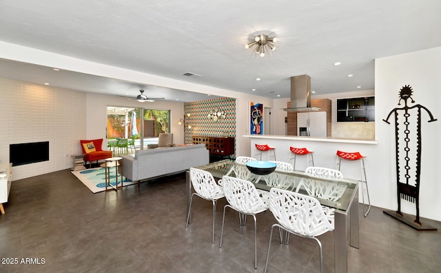 dining area featuring recessed lighting, a fireplace, and visible vents