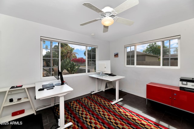 tiled home office with a ceiling fan