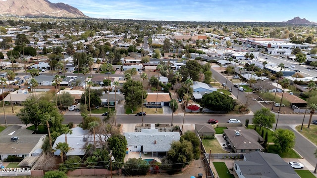 birds eye view of property with a mountain view and a residential view