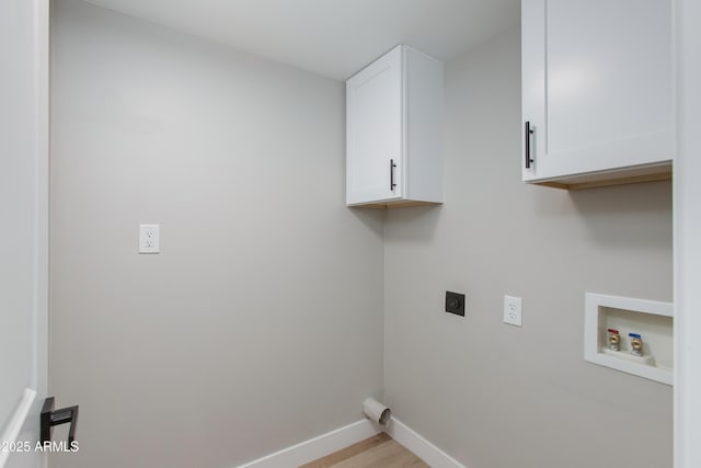 laundry area with baseboards, washer hookup, light wood-style floors, cabinet space, and electric dryer hookup