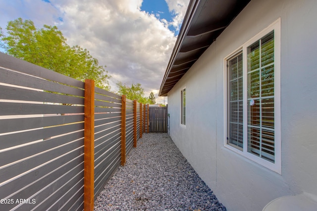 view of property exterior featuring a fenced backyard and stucco siding