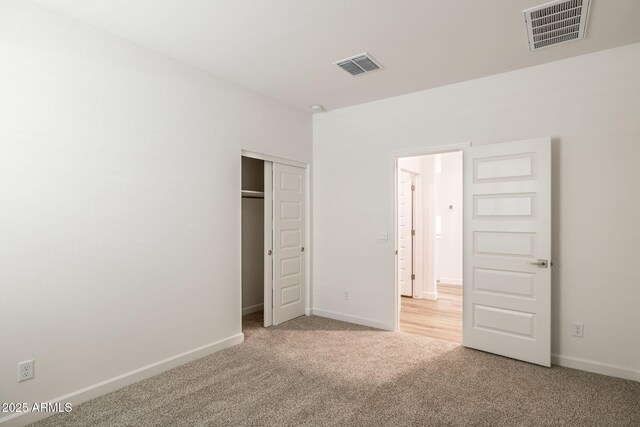 17746 W Turquoise Ave, Waddell, AZ 85355 - unfurnished bedroom with carpet flooring and a closet