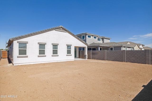 17746 W Turquoise Ave, Waddell, AZ 85355 - rear view of property featuring a fenced backyard and stucco siding