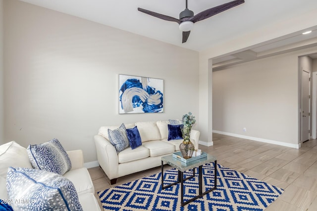 living room with hardwood / wood-style flooring and ceiling fan