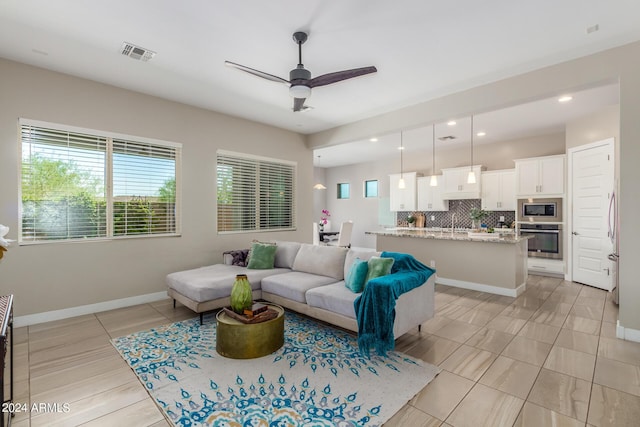 living room featuring ceiling fan