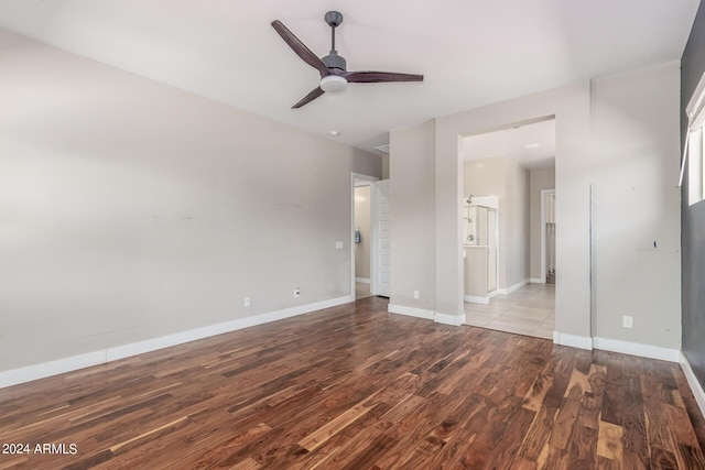 empty room featuring hardwood / wood-style flooring and ceiling fan