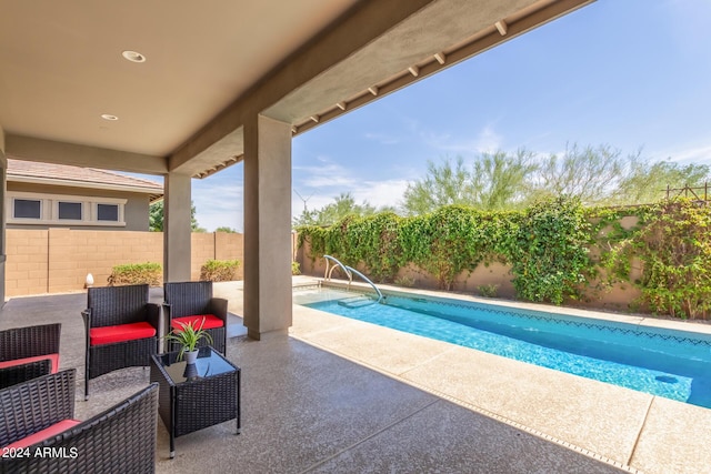 view of swimming pool featuring a patio area