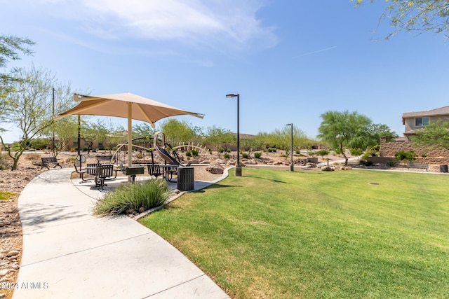 view of community with a lawn and a playground