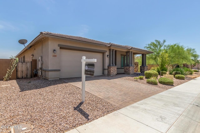 view of front of home with a garage