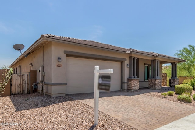 exterior space with a porch and a garage