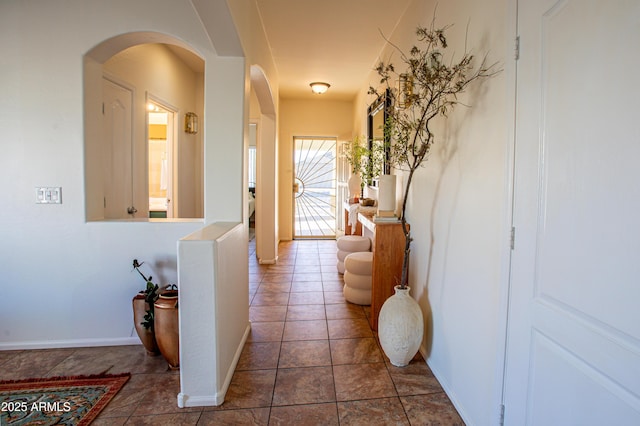 4386 E Mine Shaft Rd, San Tan Valley, AZ 85143 - corridor with baseboards, arched walkways, and tile patterned floors