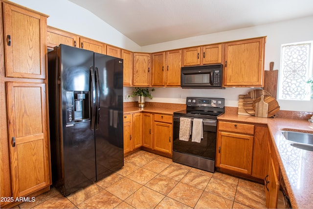 4386 E Mine Shaft Rd, San Tan Valley, AZ 85143 - kitchen with light countertops, brown cabinetry, black appliances, and lofted ceiling