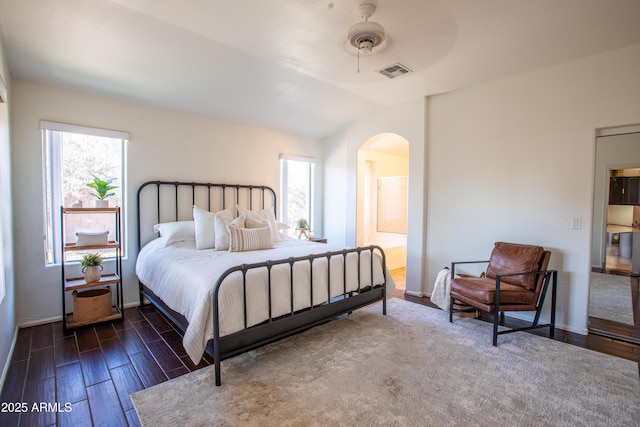 4386 E Mine Shaft Rd, San Tan Valley, AZ 85143 - bedroom with arched walkways, visible vents, vaulted ceiling, and multiple windows
