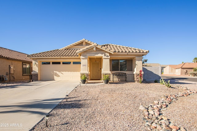 4386 E Mine Shaft Rd, San Tan Valley, AZ 85143 - view of front facade with a tiled roof, stucco siding, an attached garage, and concrete driveway