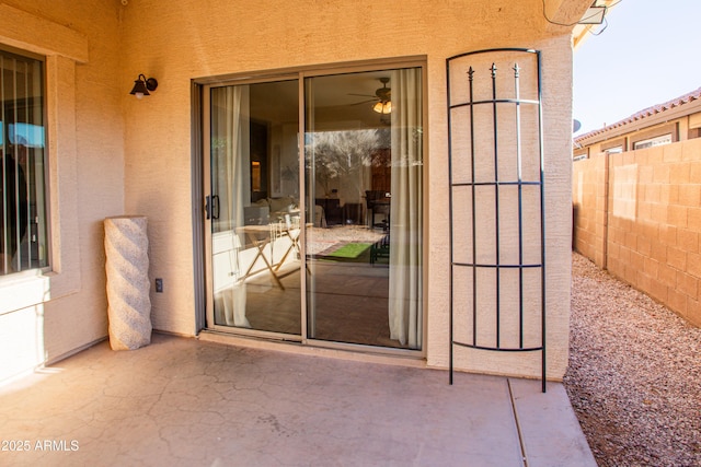 4386 E Mine Shaft Rd, San Tan Valley, AZ 85143 - view of exterior entry with stucco siding, fence, and a patio