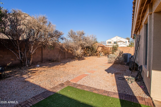 4386 E Mine Shaft Rd, San Tan Valley, AZ 85143 - view of yard featuring a fenced backyard and central AC