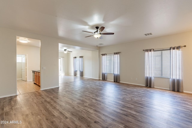 empty room featuring ceiling fan and light hardwood / wood-style floors