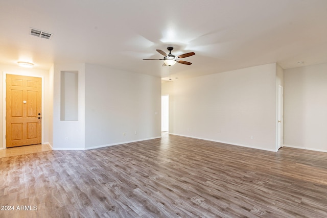 unfurnished room featuring ceiling fan and light hardwood / wood-style flooring