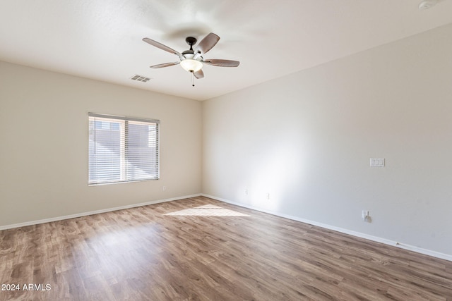 unfurnished room featuring ceiling fan and hardwood / wood-style floors