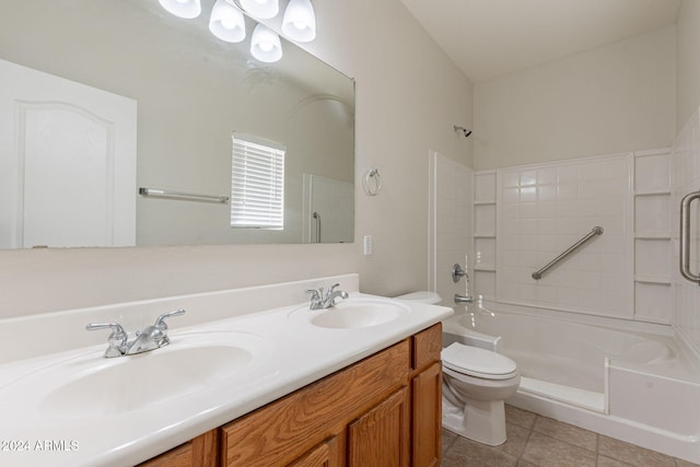 full bathroom featuring tub / shower combination, vanity, tile patterned floors, and toilet