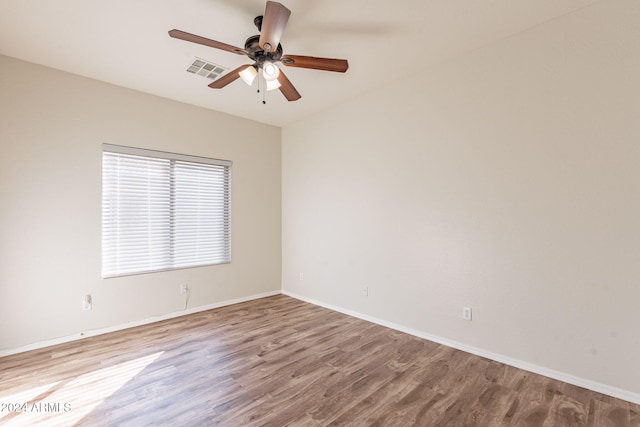 spare room featuring ceiling fan and light hardwood / wood-style flooring