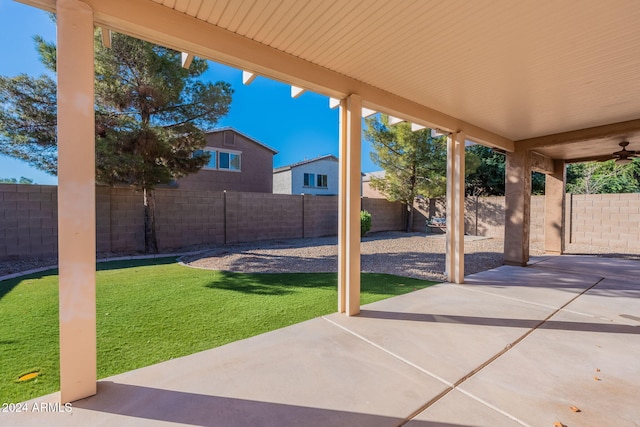 view of patio featuring ceiling fan