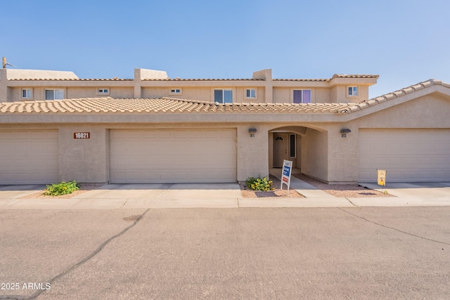 16021 N 30th St Unit 122, Phoenix, AZ 85032 - view of front of home featuring stucco siding and driveway