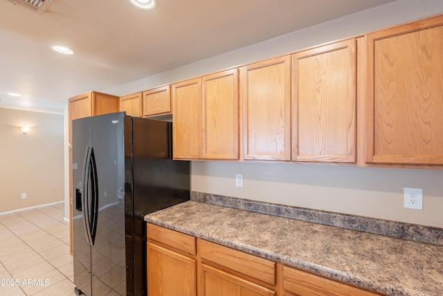 16021 N 30th St Unit 122, Phoenix, AZ 85032 - kitchen featuring black refrigerator with ice dispenser, light tile patterned floors, light brown cabinets, recessed lighting, and baseboards