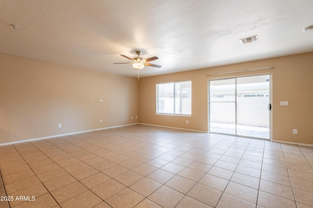 16021 N 30th St Unit 122, Phoenix, AZ 85032 - spare room featuring ceiling fan, light tile patterned floors, and baseboards