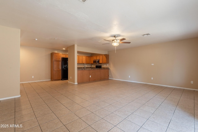16021 N 30th St Unit 122, Phoenix, AZ 85032 - unfurnished living room featuring a ceiling fan, light tile patterned floors, baseboards, and a sink