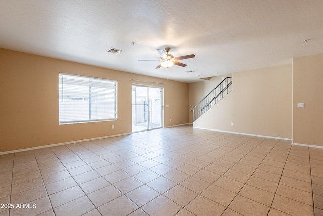 16021 N 30th St Unit 122, Phoenix, AZ 85032 - unfurnished room with ceiling fan, light tile patterned floors, stairway, and baseboards