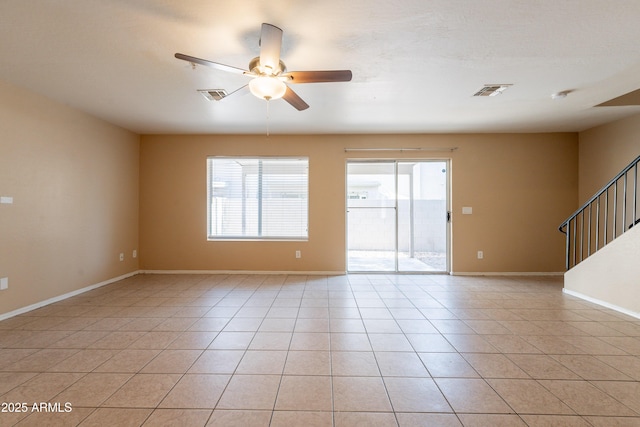 16021 N 30th St Unit 122, Phoenix, AZ 85032 - spare room with a ceiling fan, light tile patterned floors, stairs, and baseboards