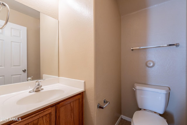 16021 N 30th St Unit 122, Phoenix, AZ 85032 - bathroom featuring toilet, vanity, and baseboards