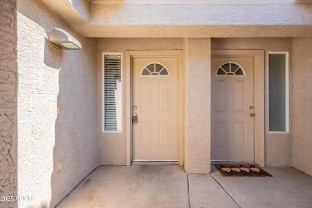 16021 N 30th St Unit 122, Phoenix, AZ 85032 - doorway to property with stucco siding