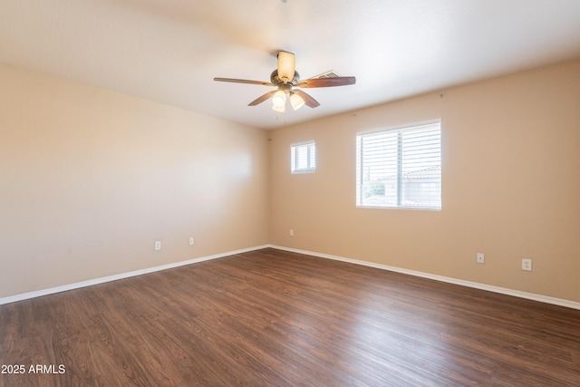 16021 N 30th St Unit 122, Phoenix, AZ 85032 - spare room with a ceiling fan, dark wood-style flooring, and baseboards