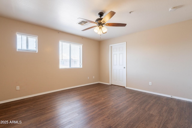 16021 N 30th St Unit 122, Phoenix, AZ 85032 - empty room featuring dark wood-type flooring, a ceiling fan, baseboards, a smoke detector, and a pendent fire sprinkler