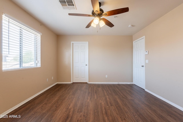 16021 N 30th St Unit 122, Phoenix, AZ 85032 - empty room with dark wood finished floors, ceiling fan, and baseboards