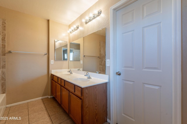 16021 N 30th St Unit 122, Phoenix, AZ 85032 - bathroom featuring a tub, tile patterned floors, baseboards, and double vanity