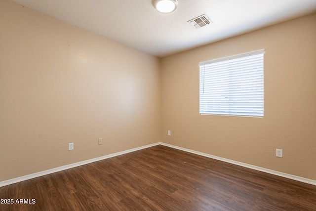 16021 N 30th St Unit 122, Phoenix, AZ 85032 - empty room featuring baseboards and dark wood-style floors