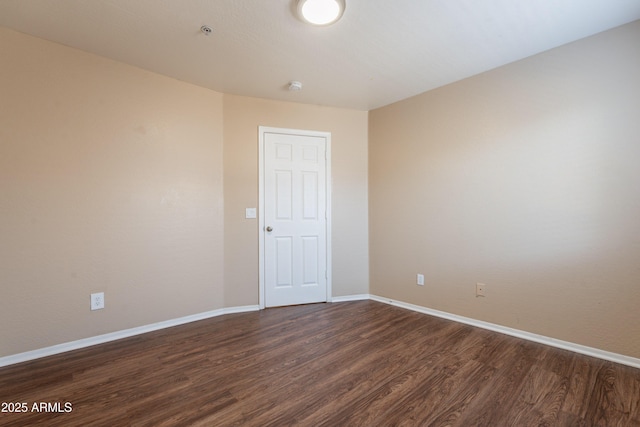 16021 N 30th St Unit 122, Phoenix, AZ 85032 - unfurnished room featuring dark wood-style floors, baseboards, and a smoke detector